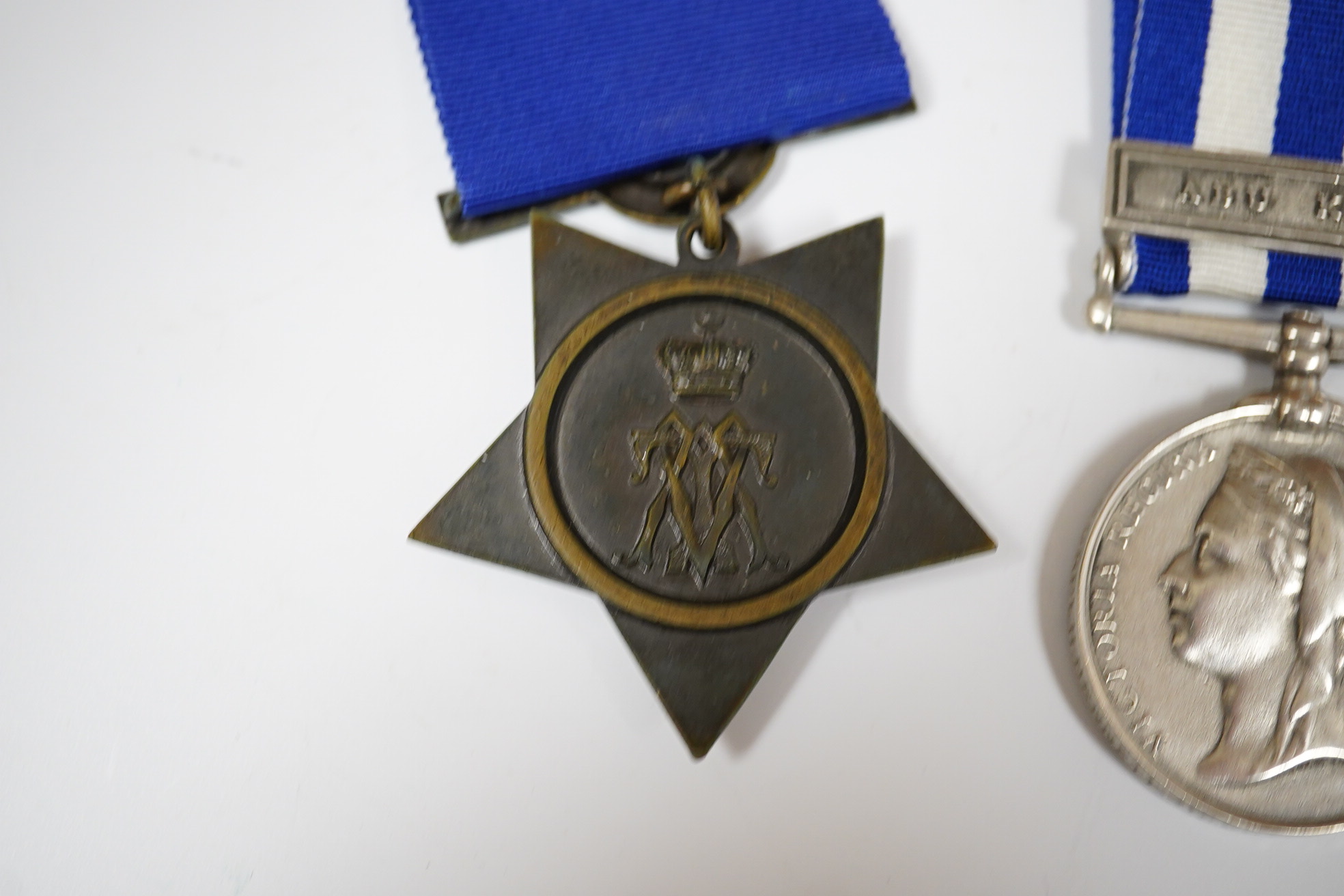 An Egypt Medal 1882-89 with Abu Klea clasp to Corpl H.Bennett 4th Coy. 2nd Batt. Gren. Gds. and a replica Khedive's Star 1882.